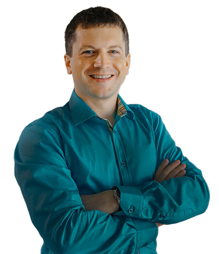 A man smiling confidently with arms crossed, wearing a turquoise button-up shirt against a plain background. The image suggests a professional setting, appropriate for themes related to software development and collaboration.